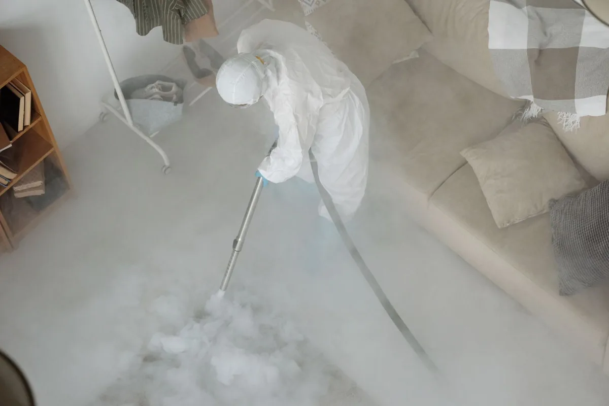 Biohazard cleanup technician in protective equipment, Euclid, OH